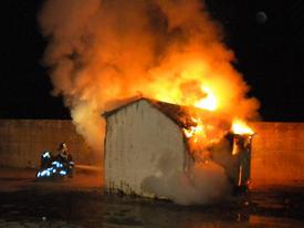 IFCO members put out shed fire during handline drill. (1/23/10)